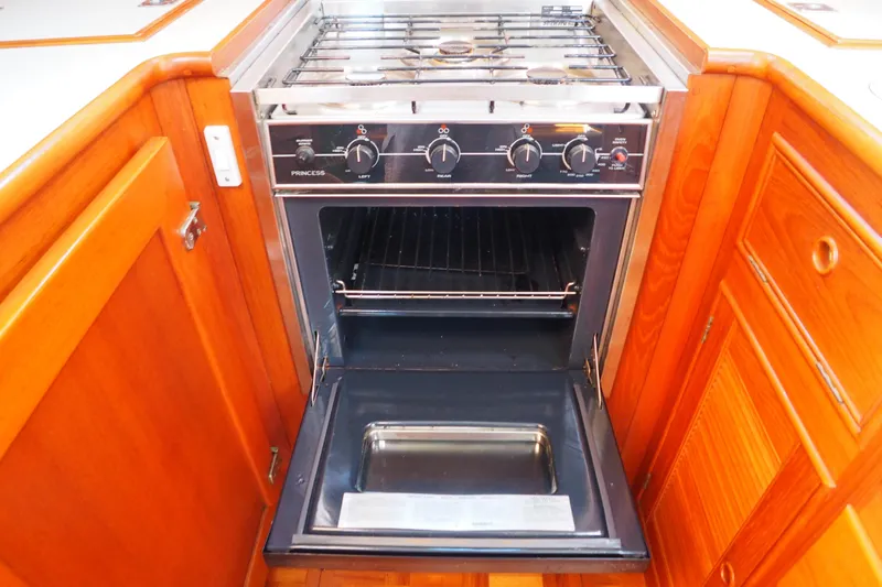"bootlegger"-repowered Yacht Photos Pics Stainless steel oven in 1995 Grand Banks 38 Eastbay EX yacht kitchen.
