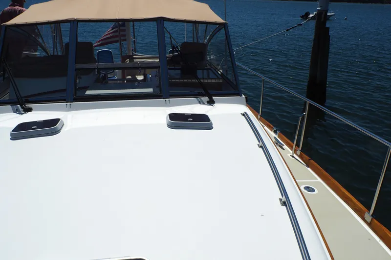 "bootlegger"-repowered Yacht Photos Pics 1995 Grand Banks 38 Eastbay EX yacht deck with water view.