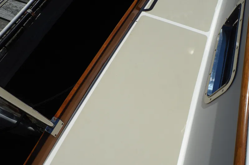 "bootlegger"-repowered Yacht Photos Pics 1995 Grand Banks 38 Eastbay EX boat deck with wood trim and window detail.