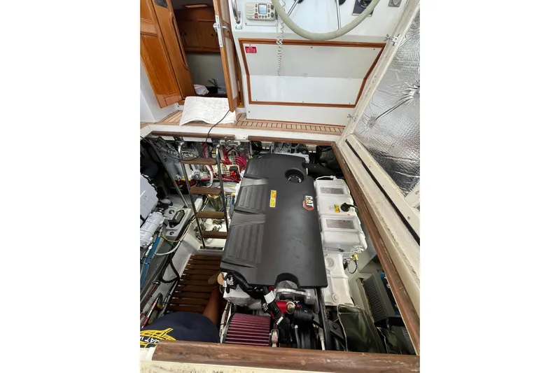 "bootlegger"-repowered Yacht Photos Pics Engine compartment of 1995 Grand Banks 38 Eastbay EX yacht, showcasing detailed machinery.