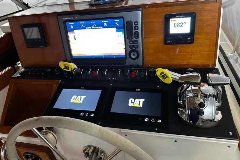 "bootlegger"-repowered Yacht Photos Pics Helm of 1995 Grand Banks 38 Eastbay EX with navigation and control systems.