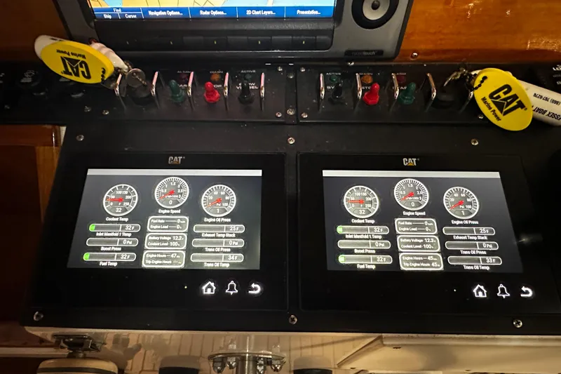 "bootlegger"-repowered Yacht Photos Pics Control panel of a 1995 Grand Banks 38 Eastbay EX with CAT engine displays.
