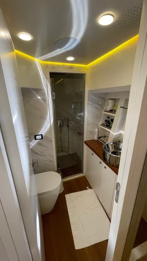 Tmr Yacht Photos Pics Modern custom bathroom with shower, sleek fixtures, and ambient lighting, 2018 model.