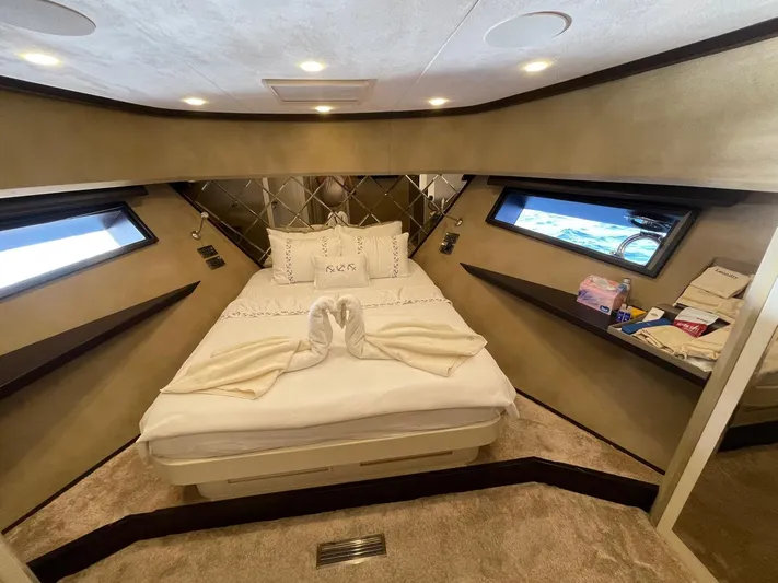 Tmr Yacht Photos Pics Luxurious yacht bedroom with elegant decor and swan towel art, Custom 84 model, 2018.