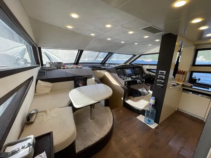 Tmr Yacht Photos Pics Luxurious yacht interior with modern seating, navigation controls, and panoramic windows, Custom 84 model, 2018.