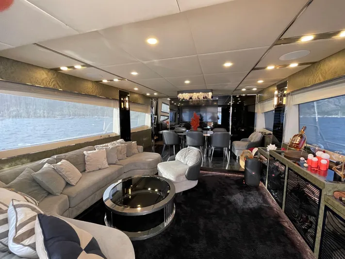 Tmr Yacht Photos Pics Luxurious yacht interior with modern seating, elegant decor, and panoramic windows, Custom 84 model, 2018.