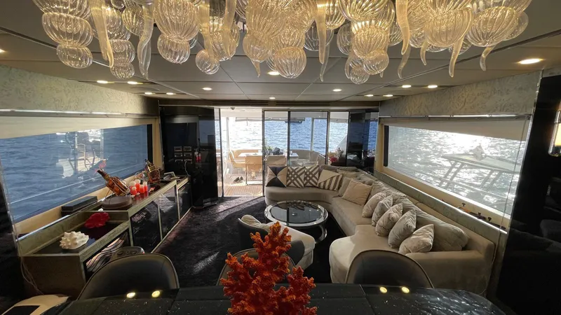 Tmr Yacht Photos Pics Luxurious yacht interior with elegant decor, large windows, and ocean view, Custom 84 model, 2018.