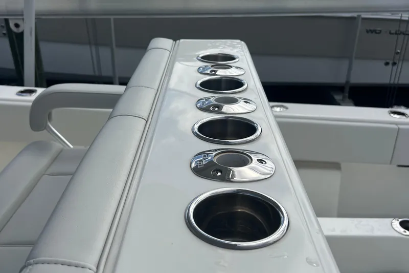  Yacht Photos Pics 2015 SeaVee 390Z boat with multiple stainless steel cup holders on a cushioned seat.