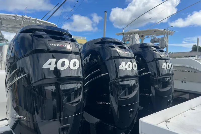  Yacht Photos Pics Triple Mercury Verado 400 engines on a 2015 SeaVee 390Z boat under a clear sky.
