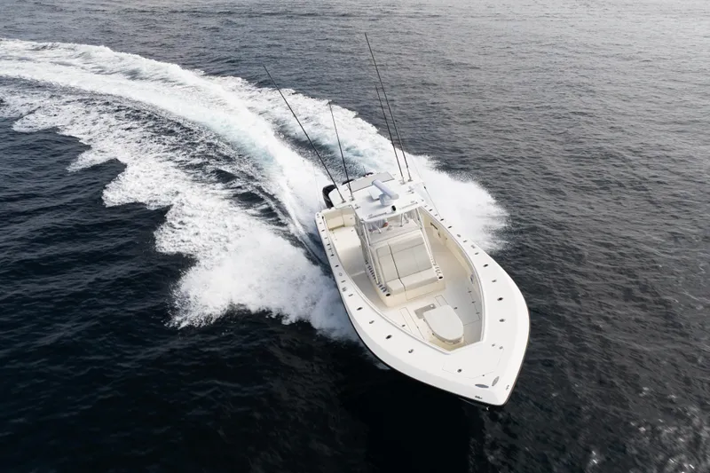  Yacht Photos Pics 2015 SeaVee 390Z boat cruising on open water, creating a wake.