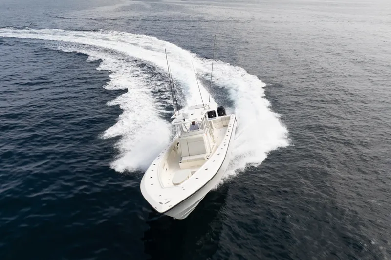  Yacht Photos Pics 2015 SeaVee 390Z boat cruising on open water, creating a dynamic wake.