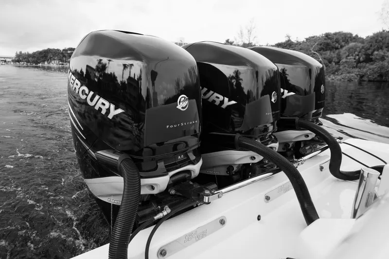  Yacht Photos Pics Triple Mercury outboard engines on a 2015 SeaVee 390Z boat, cruising on water.
