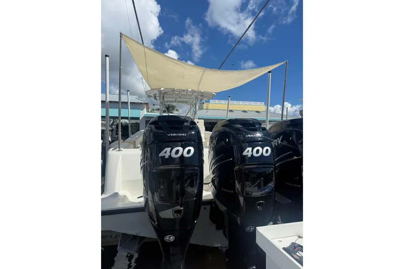  Yacht Photos Pics 2015 SeaVee 390Z boat with twin 400 horsepower Verado engines, docked under a sunshade.