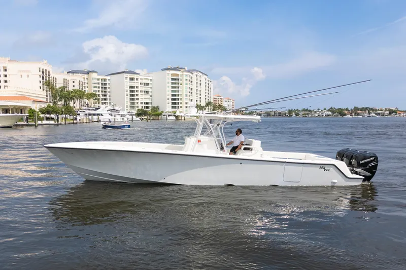  Yacht Photos Pics 2015 SeaVee 39Z boat on water, cityscape background, clear sky.