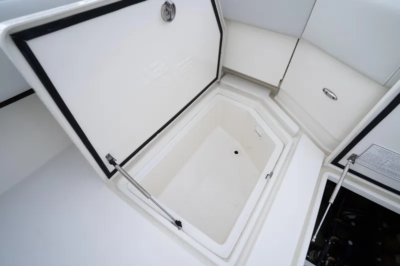  Yacht Photos Pics Open storage compartment on 2015 SeaVee 39Z boat, showcasing interior space.