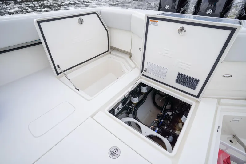  Yacht Photos Pics 2015 SeaVee 39Z boat compartments open, revealing storage and mechanical systems.