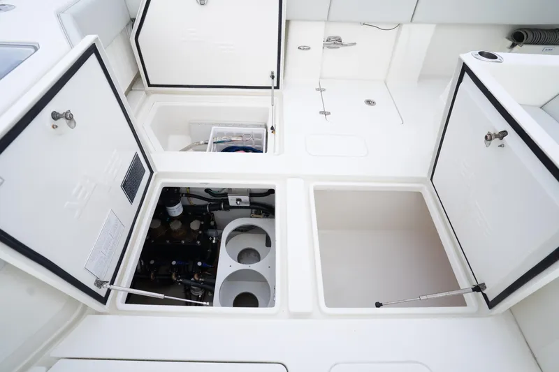  Yacht Photos Pics 2015 SeaVee 39Z boat storage compartments and engine access, open hatches revealing interior.