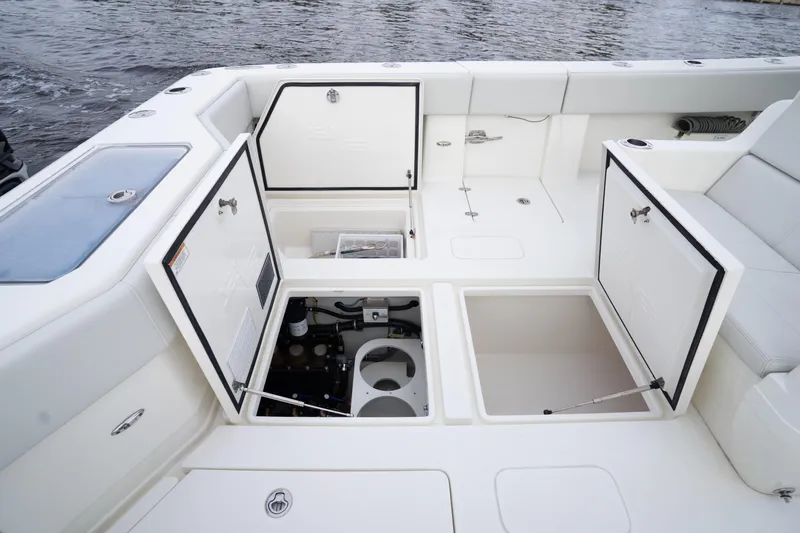  Yacht Photos Pics 2015 SeaVee 39Z boat deck with open storage compartments and seating.