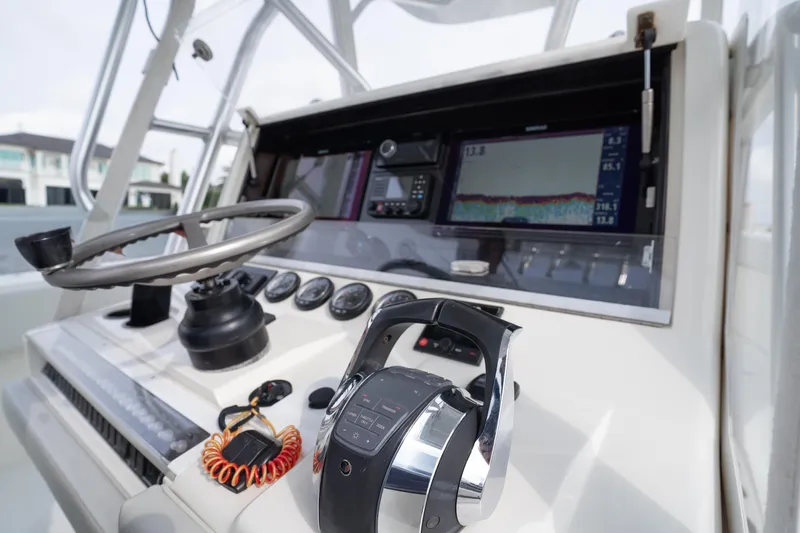  Yacht Photos Pics 2015 SeaVee 39Z boat dashboard with steering wheel and navigation controls.