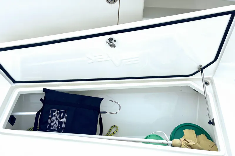  Yacht Photos Pics Open storage compartment on 2015 SeaVee 39Z boat with various items inside.