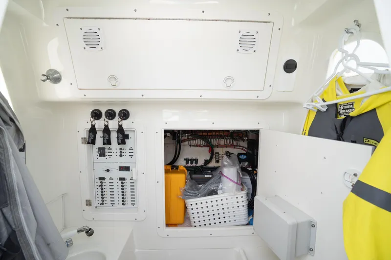  Yacht Photos Pics 2015 SeaVee 39Z boat interior showing control panel and storage area with rain gear.