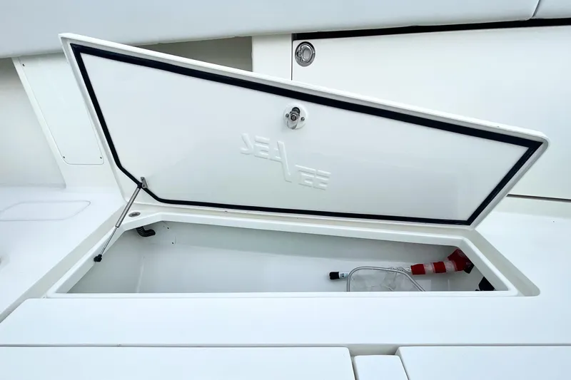  Yacht Photos Pics Open storage compartment on 2015 SeaVee 39Z boat, featuring a sleek white design.