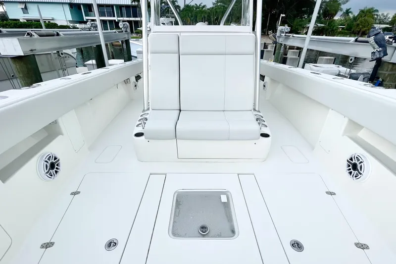  Yacht Photos Pics 2015 SeaVee 39Z boat interior with white seating and deck, docked at marina.