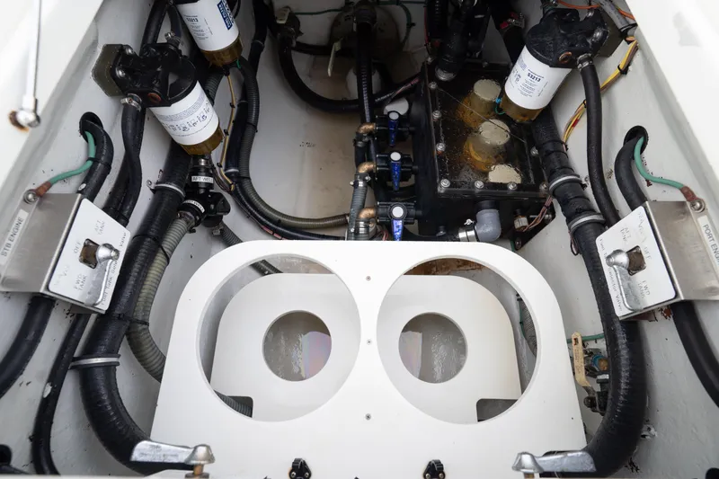  Yacht Photos Pics Engine compartment of a 2015 SeaVee 39Z boat, showcasing fuel filters and hoses.