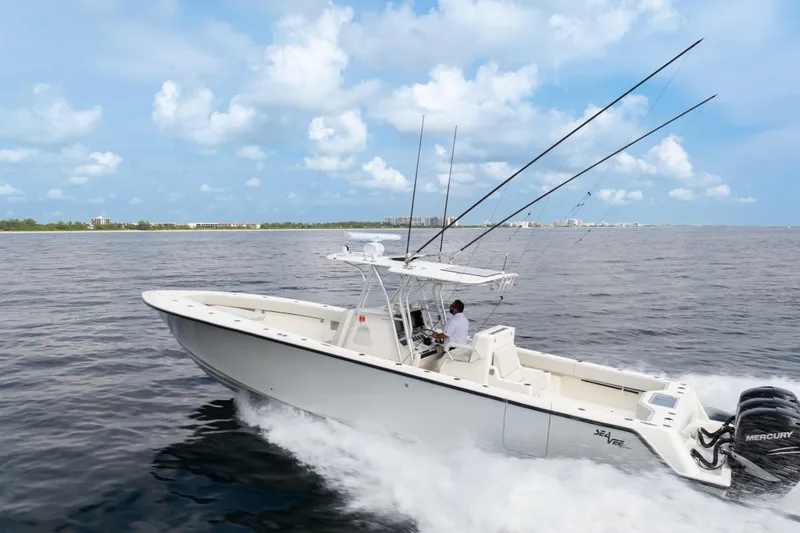  Yacht Photos Pics 2015 SeaVee 39Z boat cruising on open water under a clear blue sky.