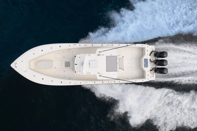  Yacht Photos Pics Aerial view of 2015 SeaVee 39Z boat cruising on water with triple engines.