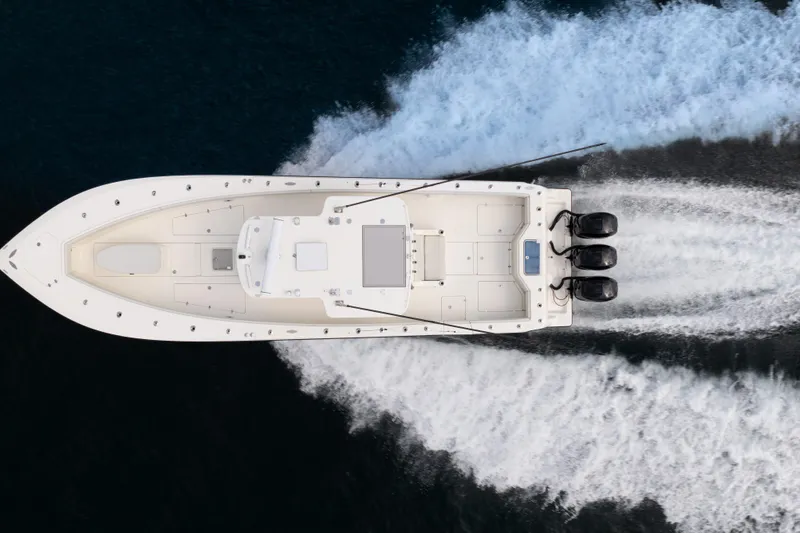  Yacht Photos Pics Aerial view of 2015 SeaVee 39Z boat cruising on water with triple engines.