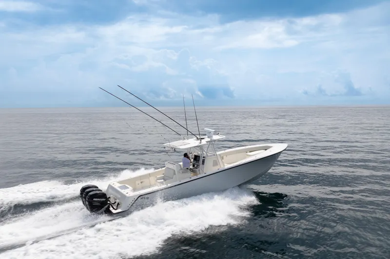  Yacht Photos Pics 2015 SeaVee 39Z boat cruising on open water under a clear blue sky.