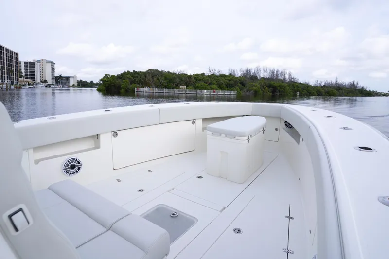  Yacht Photos Pics 2015 SeaVee 39Z boat interior with seating and storage, docked near waterfront buildings.