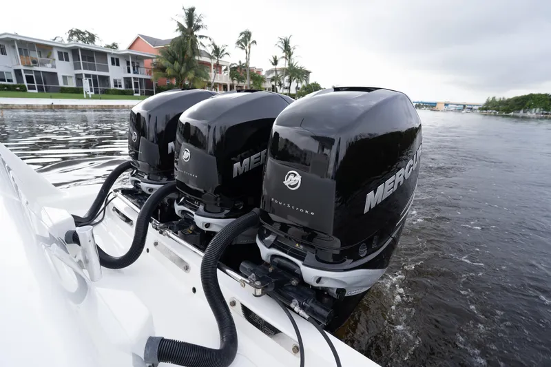  Yacht Photos Pics Triple Mercury outboard engines on a 2015 SeaVee 39Z boat, cruising in a canal.