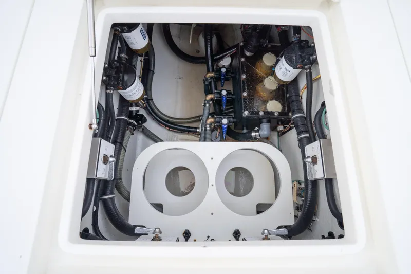  Yacht Photos Pics Engine compartment of 2015 SeaVee 39Z boat, showcasing hoses and filters.