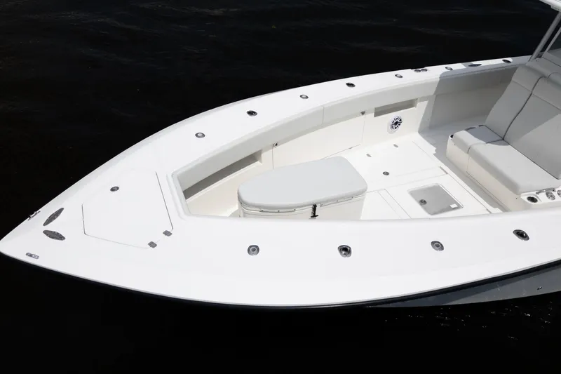  Yacht Photos Pics 2015 SeaVee 39Z boat with spacious seating and sleek white design on dark water.