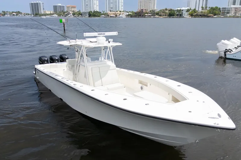  Yacht Photos Pics 2015 SeaVee 39Z boat on water with city skyline in background.