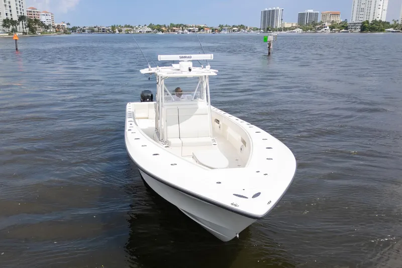  Yacht Photos Pics 2015 SeaVee 39Z boat on calm water, cityscape in background.