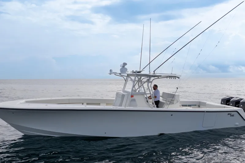  Yacht Photos Pics 2015 SeaVee 39Z boat on open water, featuring fishing rods and a center console.