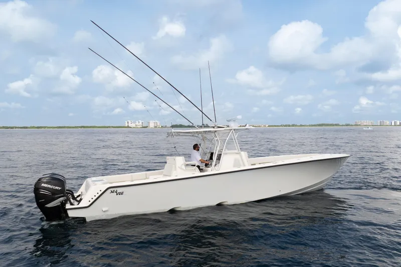  Yacht Photos Pics 2015 SeaVee 39Z boat on open water with fishing rods and Mercury engines.