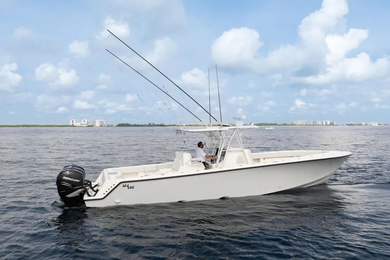  Yacht Photos Pics 2015 SeaVee 39Z boat on open water, featuring fishing rods and Mercury engines.