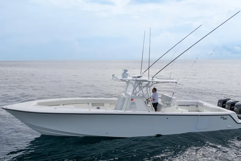 Yacht Photos Pics 2015 SeaVee 39Z boat on open water, equipped with fishing rods and multiple engines.