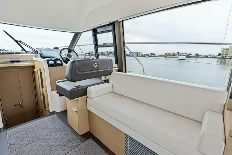 So Fly Yacht Photos Pics Interior of 2022 Prestige 420 yacht with modern helm and seating area.