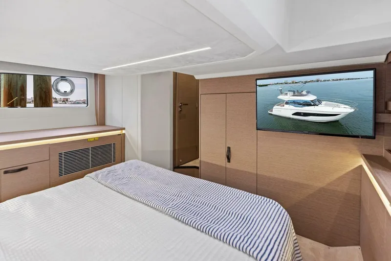 So Fly Yacht Photos Pics Luxurious 2022 Prestige 420 yacht cabin with modern interior and TV display.