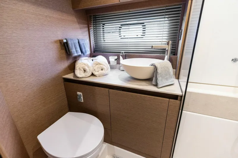So Fly Yacht Photos Pics Luxurious bathroom in 2022 Prestige 420 yacht with modern fixtures and elegant design.