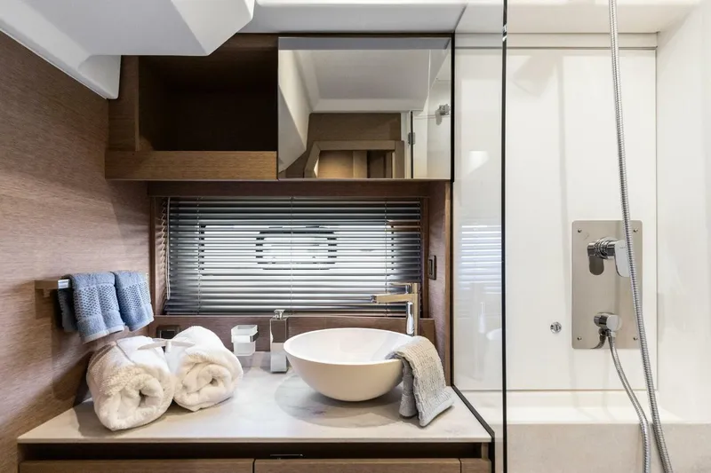 So Fly Yacht Photos Pics Luxurious bathroom in 2022 Prestige 420 yacht with modern fixtures and elegant design.