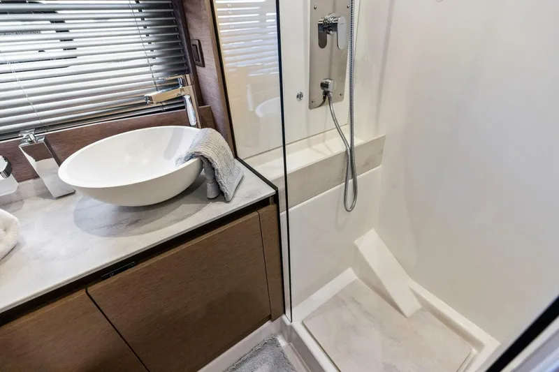 So Fly Yacht Photos Pics Modern bathroom in 2022 Prestige 420 yacht with sleek sink and shower.