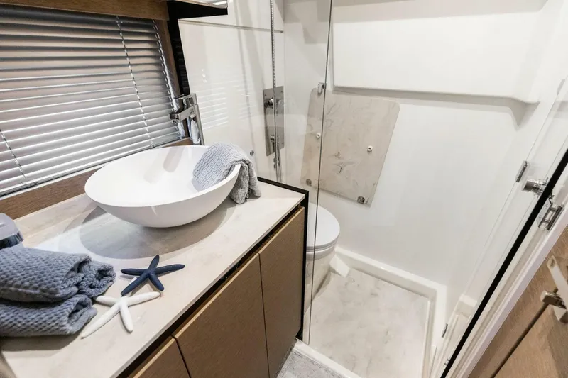 So Fly Yacht Photos Pics Modern bathroom in 2022 Prestige 420 yacht with sleek design and elegant fixtures.