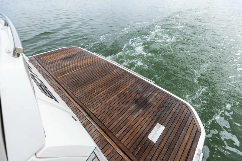So Fly Yacht Photos Pics Teak deck of 2022 Prestige 420 yacht cruising on water.