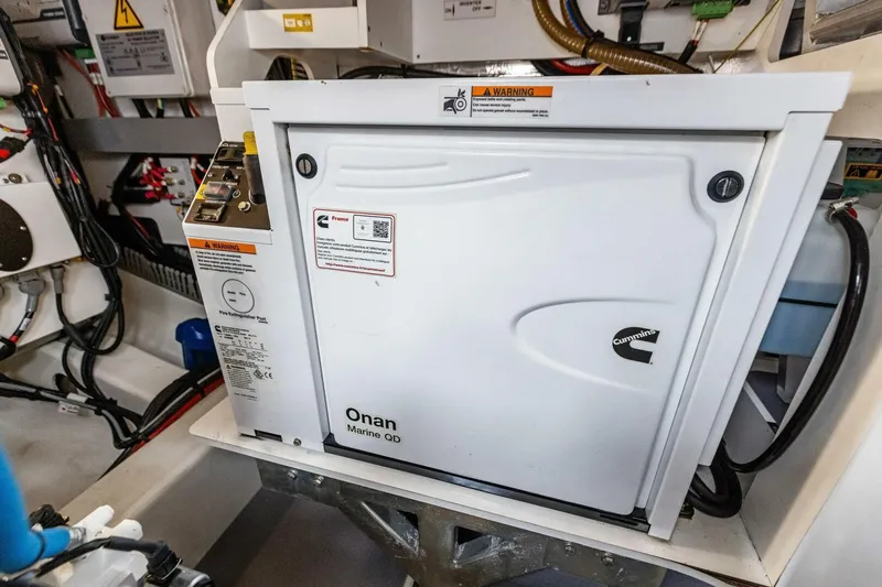 So Fly Yacht Photos Pics Engine room of 2022 Prestige 420 yacht featuring Cummins Onan Marine QD generator.